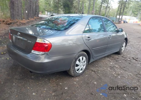 2005 Toyota Camry Le z USA, uszkodzony, nr VIN 4T1BE32K05U610924
